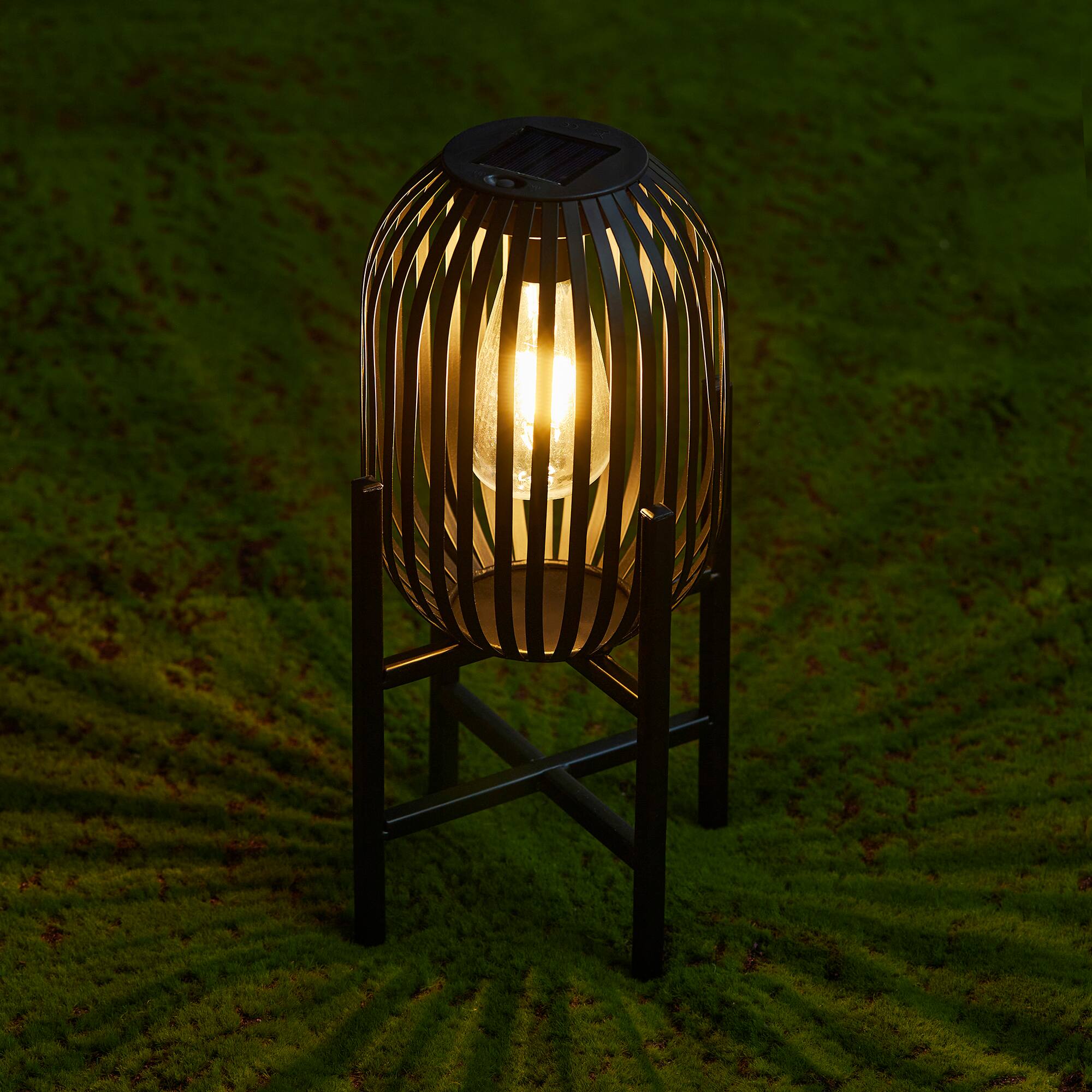 Glitzhome® 14.25" Black Slim Metal Stripes Solar Powered Edison Bulb Outdoor Lantern, 2ct.